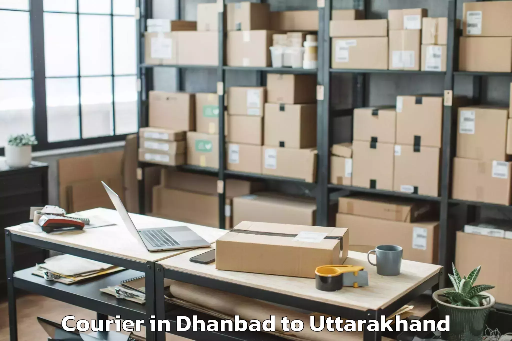 Easy Dhanbad to Banbasa Courier Booking